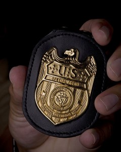 478px-NCIS_Badge_in_hand